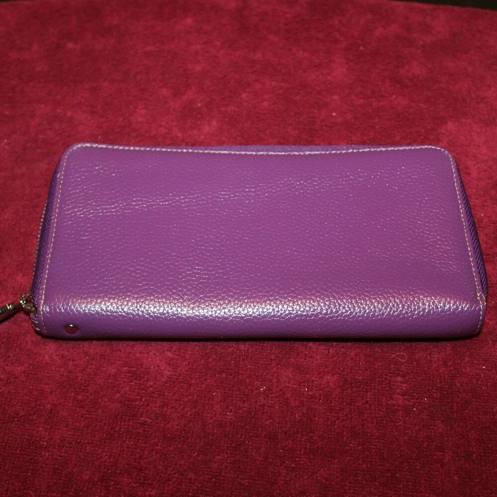 Lavemi purple leather look wallet with a zip-around closure